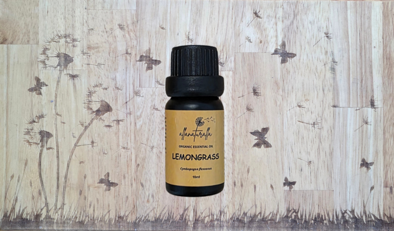 Lemongrass essential oil bottle on a wooden background with botanical illustrations